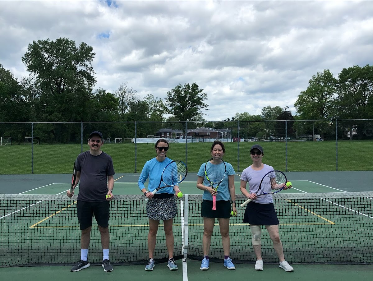Adult tennis clinic session