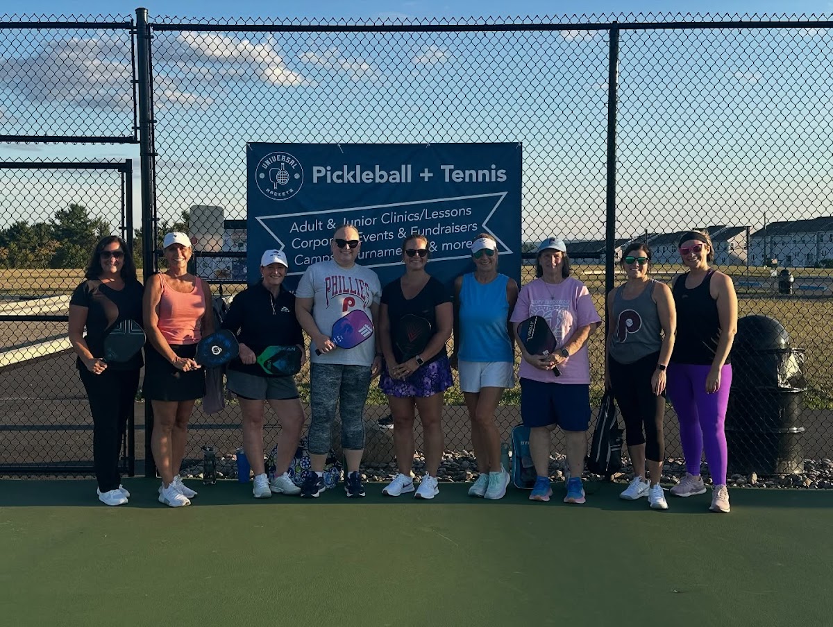 Adults drilling at a pickleball clinic